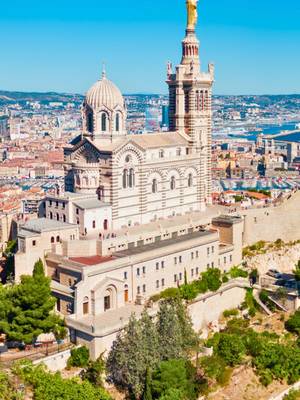 Notre-Dame de la Garde – Iconic panoramic view over Marseille, France. Admire the Notre-Dame de la Garde basilica perched above Marseille, offering breathtaking panoramic views of the city – Guided tour included with the Marseille Pass.